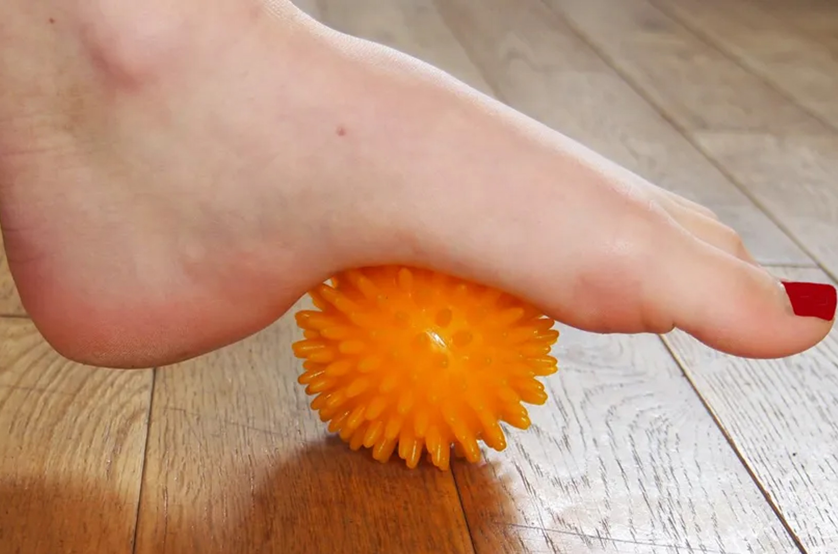 Foot on a prickle ball